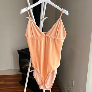 Baserange Mississippi bodysuit in tala orange